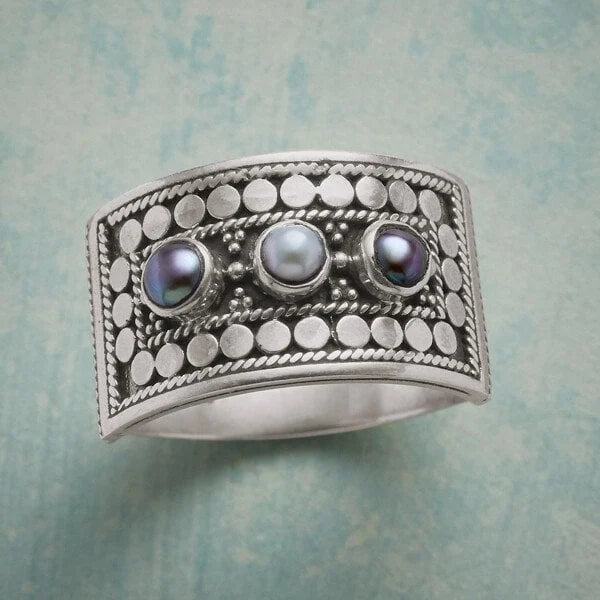 Geometric ring with carved pearl and three stones
