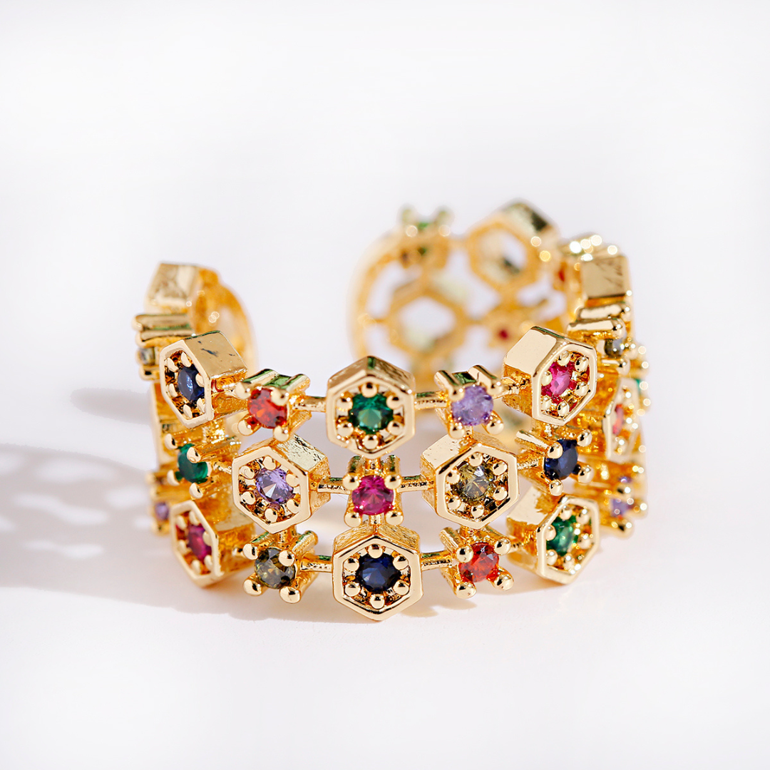 Adjustable ring made of 18K gold with colored zircon stones