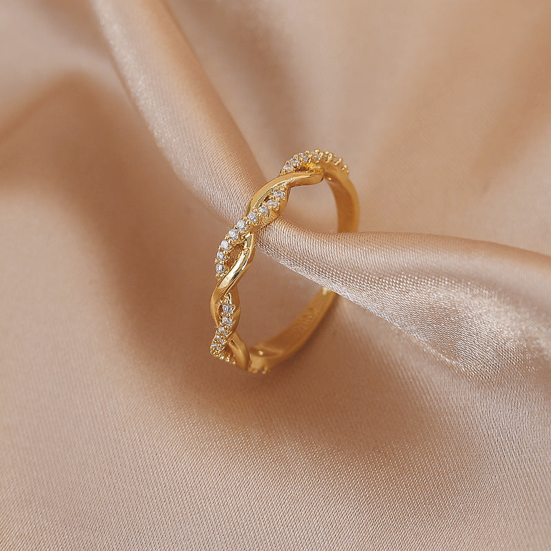 Adjustable ring with braided gold zirconia stones