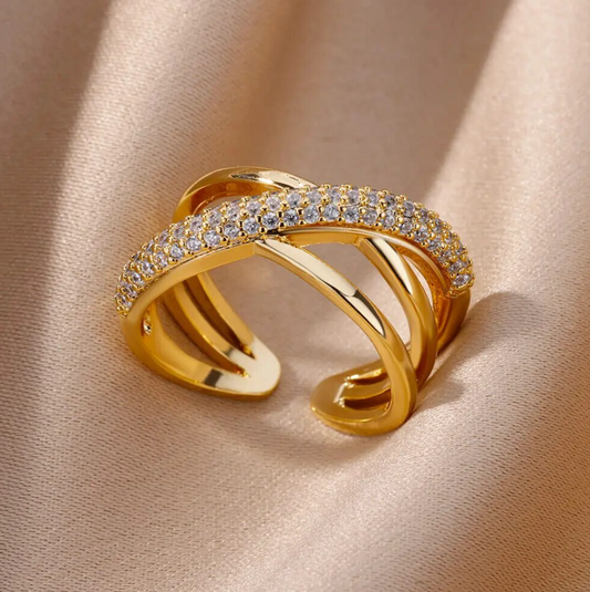 18 Karat gold-plated ring with intertwined paths with zirconias