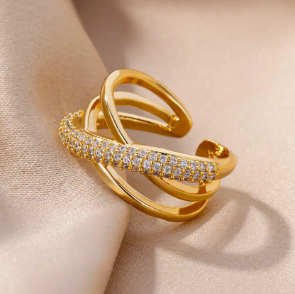 18 Karat gold-plated ring with intertwined paths with zirconias