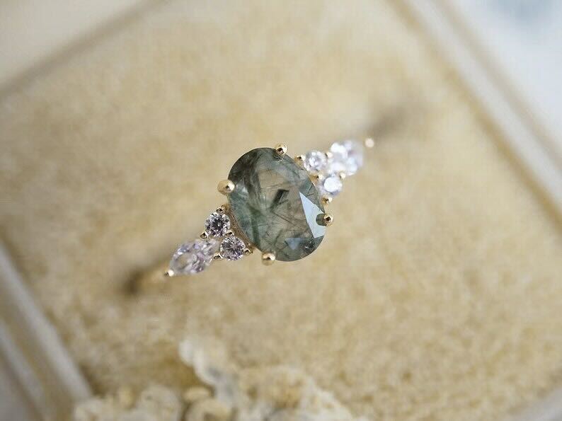 18 Karat gold-plated ring with green energetic crystal