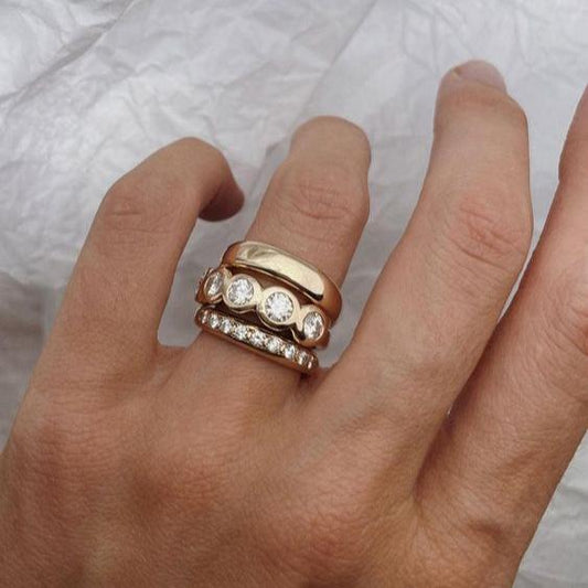Set of forged rings in brilliant gold