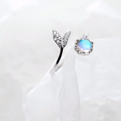 Adjustable Ring with Dolphin Tail made of Sterling Silver and Blue Zirconia